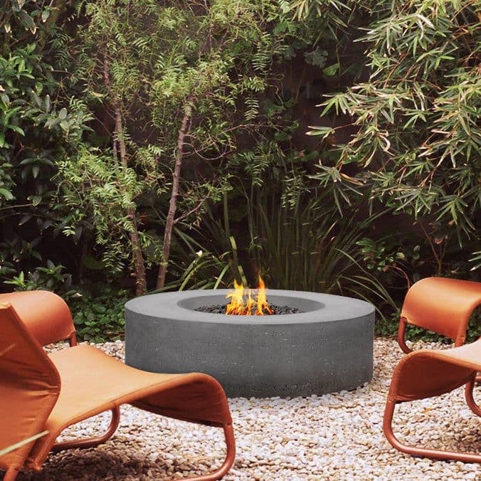 Copper fire bowl on stone patio